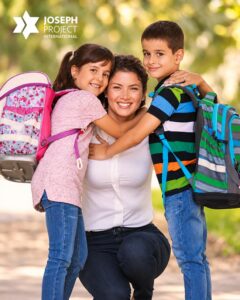 Children in Israel receiving new school backpacks